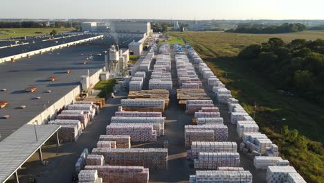 Industry-scene-of-outdoor-storage-area-full-of-Tile-Factory-inventory---aerial-drone-shot