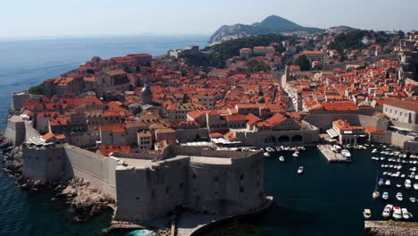 Dubrovnik-Old-Town-Surrounded-By-Fortified-Walls-On-The-Adriatic-Sea,-Croatia---aerial-drone-shot