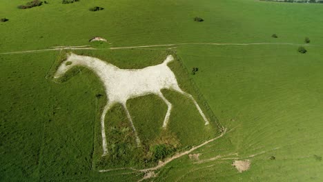 Alton-Barnes-white-horse-Milk-hill-iconic-chalk-figure-landmark-aerial-Birdseye-rotating-right-view
