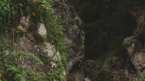 Rugged-Cliffs-With-Small-Waterfall-At-Natural-Pool-In-Balneario-Mata-de-Maiz,-Polo,-Barahona-Province,-Dominican-Republic