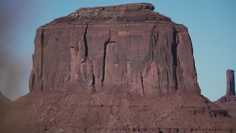 Young-man-walking-out-to-overlook-in-Monument-Valley-Arizona,-slow-motion
