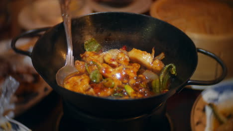 Sizzling-Chinese-chili-chicken-stir-fry-in-iron-wok