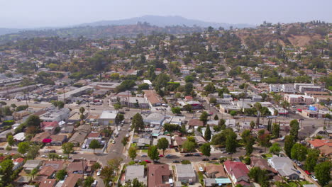 Aerial-view-of-Eagle-Rock-neighborhood-in-Los-Angeles,-California-with-tilt-up-to-reveal-the-horizon