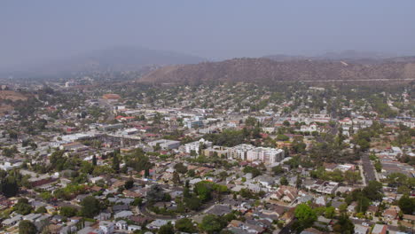 Pull-away-over-Eagle-Rock-neighborhood-in-Los-Angeles,-California-on-a-hazy-summer-day