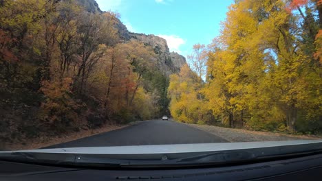 Driving-through-American-Fork-Canyon-in-fall,-autumnal-colors,-dashboard-cam