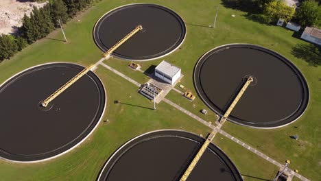Aerial-tllt-down-shot-of-environmental-water-filtration-pools-at-Sewage-Treatment-Plant-in-Buenos-Aires