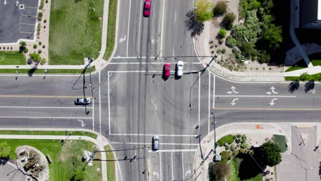 Static-aerial-view-directly-above-car-traffic-and-road-intersection