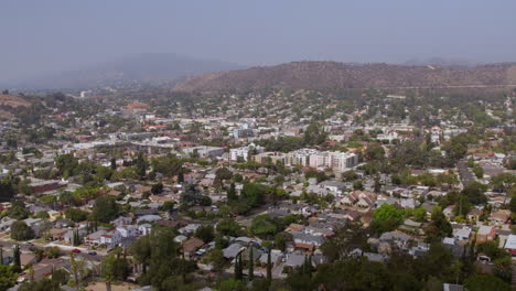 Aerial-rise-over-Eagle-Rock-in-Los-Angeles,-California-on-a-pretty-summer-day