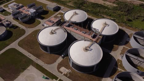 Aerial-top-down-shot-of-big-water-tanks-in-water-purification-plant-in-Buenos-Aires---Giant-Sewage-treatment-facility