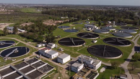 Aerial-shot-of-large-modern-Water-Purification-Plant-with-tanks-during-sunlight-in-Buenos-Aires,Argentina