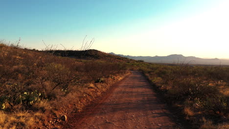 Backcountry-Dirt-Road-With-Bright-Sky-In-Background-Near-Rio-Rico,-Arizona,-USA