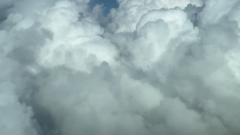 Flying-trough-withe-clouds-in-a-blue-sky
