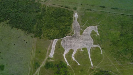 Osmington-White-Horse-limestone-hillside-sculpture-countryside-tourist-attraction-aerial-Birdseye-view