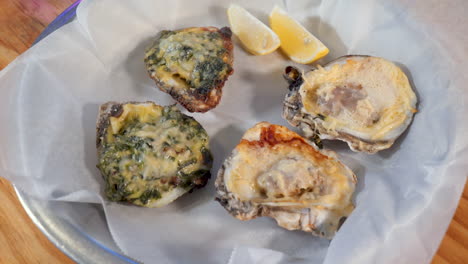 Two-versions-of-grilled-oysters,-Birdseye-view-of-grilled-oyster-appetizer,-HD