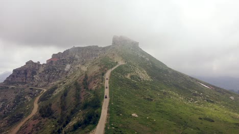 Off-road-Vehicles-Going-Down-On-Mountain-Trail-On-A-Foggy-Day-In-Lebanon