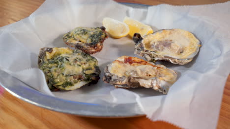 Two-pairs-of-grilled-oysters,-oysters-rockefeller,-HD