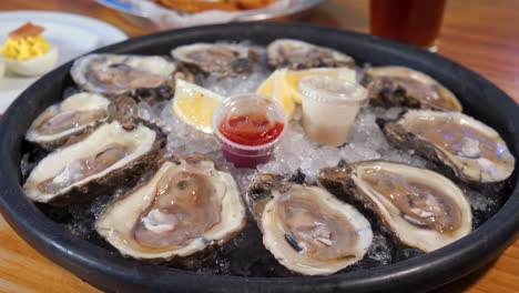 A-dozen-oysters-on-the-half-shell,platter-of-freshly-shucked-raw-oysters