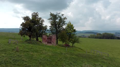 isolated-ruins-of-a-chapel-on-a-meadow-in-north-Bohemia,-orbit-right