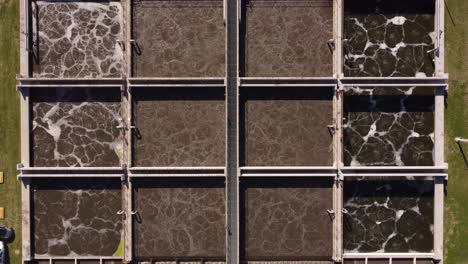 Top-down-view-of-AySA-water-purification-plant-in-Buenos-Aires-Argentina-where-dirty-water-is-collected-in-big-square-tanks-for-the-purpose-purification
