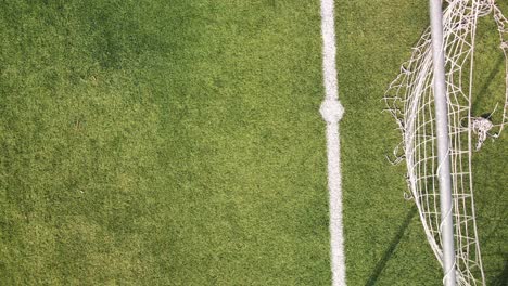 Aerial-overhead-view-of-soccer-net-from-drone