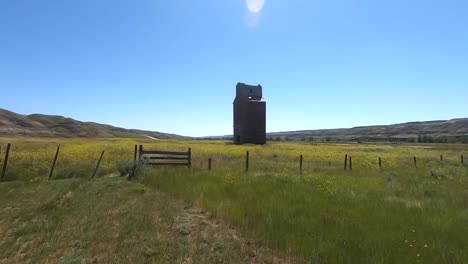 Old-wooden-grain-tower-in-the-country-near-Alberta-Canada-during-the-summer
