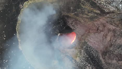 Amazing-Spinning-descending-Aerial-shot-over-red-Lava-lake-of-Masaya,-the-“Mouth-of-Hell”,-Nicaragua