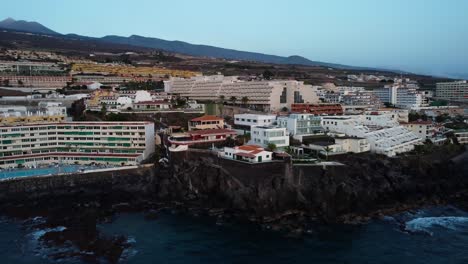 Amazing-Scenery-of-City-Of-Los-Gigantes-In-Spain-Tenerife-Drone-Shot-in-4K-Cityscape-Landscape-Sea-Seaside-Seashore-Coastline-Coast-Buildings-Hotels