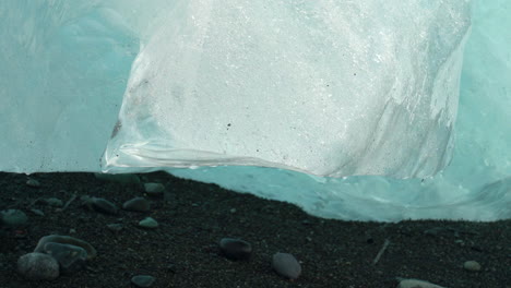 Close-up-of-melting-iceberg-in-Iceland-during-heat-in-summer---global-warming-and-climate-change-on-earth