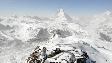 Aerial-view-of-Gornergrat-train-station-with-a-view-of-the-Matterhorn-during-winter