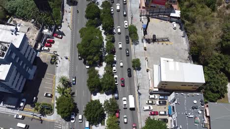 Santo-domingo---dominican-republic---May-29,-2021--An-aerial-view-of-the-main-street-winston-churchill-Part-of-the-santo-domingo-metropolitan-area,-wide-drone-view