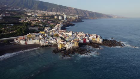 Colorful-coastal-neighbourhood,-Punta-Brava-Tenerife,-Aerial-drone-orbit