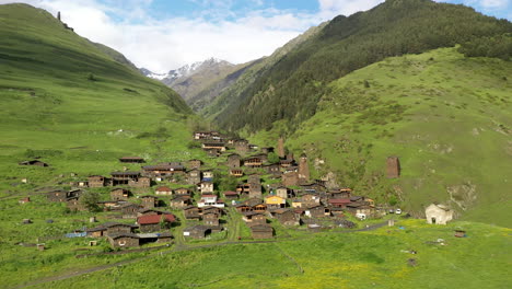 Rotating-drone-shot-of-Dartlo-Village-in-Tusheti-Georgia-with-medieval-combat-towers