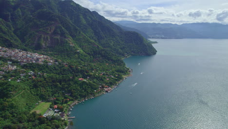 Drone-aerial-footage-of-lakeside-indigenous-town-docks-of-Santa-Cruz-La-Laguna,-Guatemala-in-Lake-Atitlan-in-Central-America-highlands