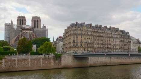 Ile-de-la-Cite-with-rebuilt-Notre-Dame-de-Paris-cathedral-beside-Seine-River-in-Paris---4k