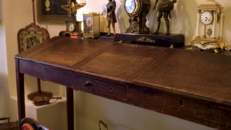 antique-writing-table-with-vintage-clocks-on-top-old-fashioned-used-historic-item-19th-century-smooth-motion