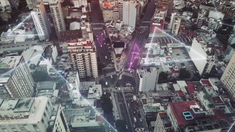 Aerial-top-down-showing-traffic-on-road-fork-between-skyscraper-buildings---Digital-future-concept-with-glowing-digital-lines-connecting-city-and-cars---Prores-uhd-footage