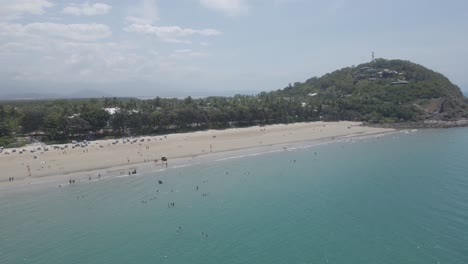Aerial-View-Of-The-Tourists-Swimming-And-Walking-At-Four-Mile-Beach-In-FNQ,-Australia