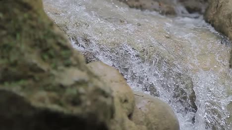 waterfall-flowing-in-the-beautiful-mountain,-Slow-motion-and-zoom-in