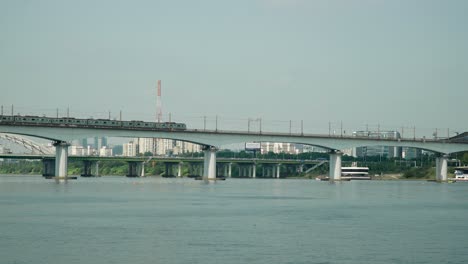 Railway-Train-Moving-Along-Dangsan-Railroad-Bridge-or-Iron-Bridge-over-Han-river-in-Yeouido,-Seoul-static-daytime