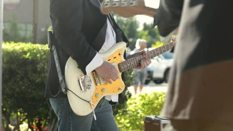 Man-Lead-Guitarist-Playing-Electrical-Guitar-At-Daytime-Outdoor-Concert