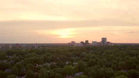 Downtown-Clayton-city-skyline-on-horizon-at-sunset-on-a-pretty-evening-with-a-slow-descent-down