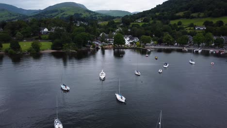 Aerial-view-over-boats-docked-on-Windermere-Lake-at-Waterhead-Marina-near-Ambleside,-Lake-District