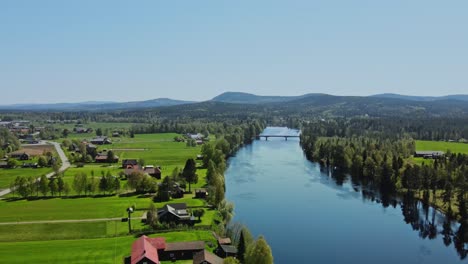 Countryside-With-Idyllic-Village-By-The-River-Vasterdalalven-In-Appelbo,-Dalarna-County,-Sweden