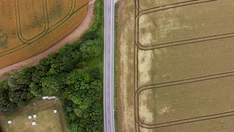 4K-drone-birds-eye-view-video-of-a-country-road-in-Kent,-England