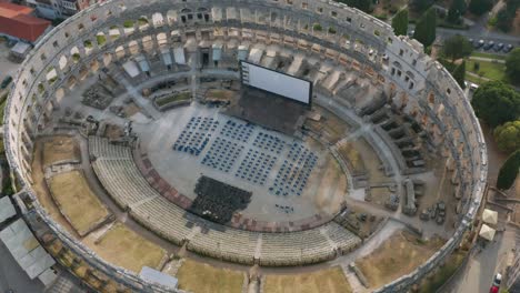 Aerial-view-of-the-big-Pula-Arena-with-a-stage-with-a-screen-in-Croatia