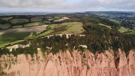 Aerial-View-Of-Coastal-Jurassic-Cliffs-near-Sidmouth-in-Devon