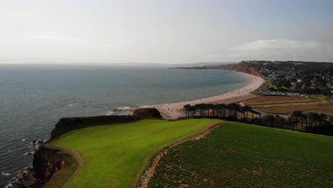 Aerial-Over-Green-Landscape-With-Budleigh-Salterton-In-the-Background