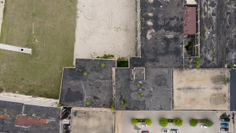 Aerial-crumbling-factory-roof-in-Muskegon,-MI