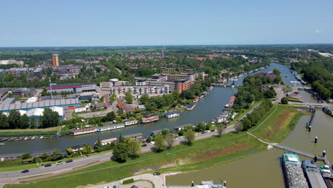 Jib-down-of-beautiful-Dutch-city-skyline-near-a-long-river