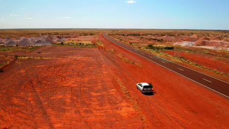 Car-Park-On-Red-Desert-By-The-Road-Near-Alice-Springs-In-Northern-Territory,-Australia